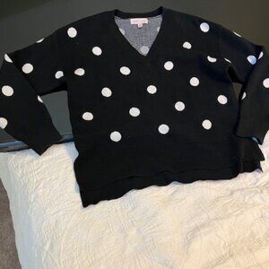 Black sweater with white polka dots